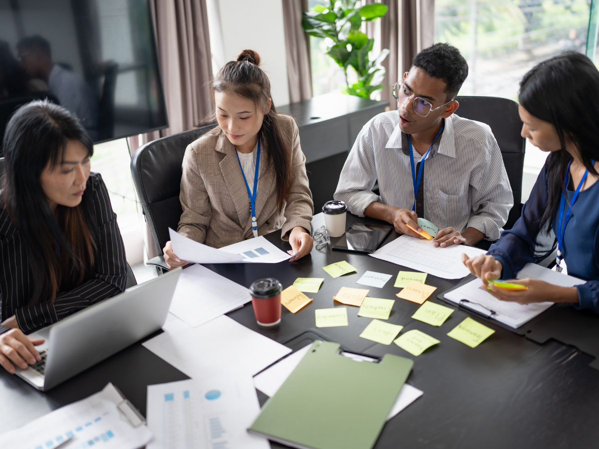 Multicultural business team collaborating on localization strategies